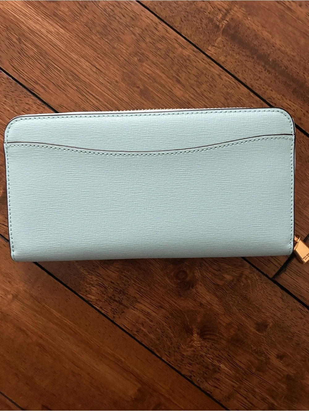 kate spade light blue zip-around wallet with gold logo